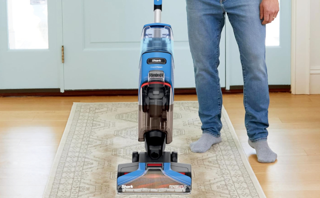 A Person Using a Shark CarpetXpert Upright Carpet Cleaner