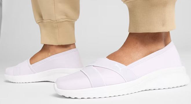A Person Wearing PUMA Adelina 2 Slip On Shoes