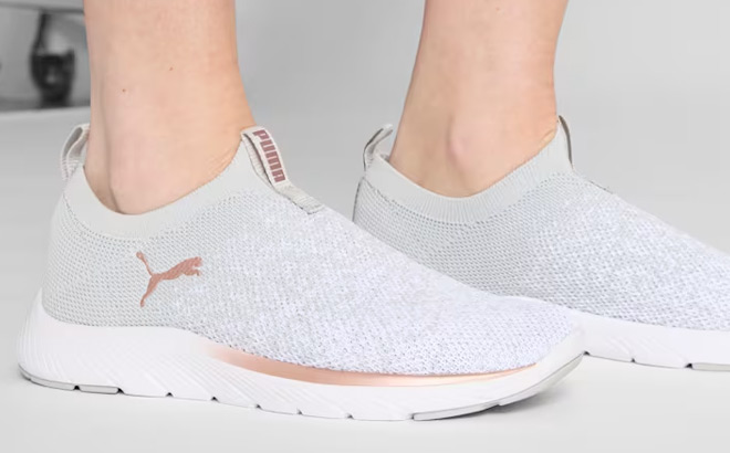 A Person Wearing PUMA Softride Remi Slip On Knit Running Shoes