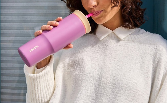 A Woman Drinking from the Owala 24 Ounce Tumbler A Woman Drinking from the Owala 24 Ounce Tumbler