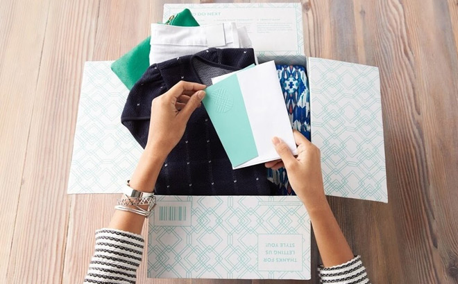 A Woman Opening Stitch Fix Box A Woman Opening Stitch Fix Box