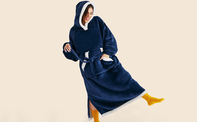 A Woman Wearing Bedsure Wearable Blanket Hoodie in Navy