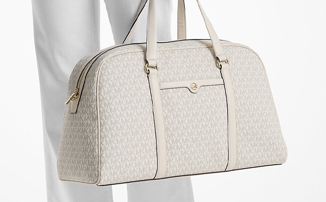 Michael Kors Jet Set Travel Extra Large Signature Logo Weekender Bag in Cream Michael Kors Jet Set Travel Extra Large Signature Logo Weekender Bag in Cream