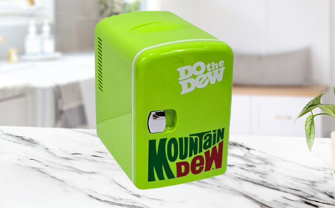 Mountain Dew Mini Portable Compact Personal Fridge on the Kitchen Counter