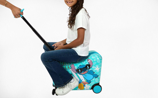 A Child Riding on a Disneys Lilo Stitch Ride On Luggage