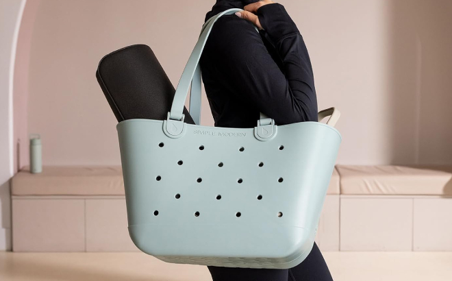 A Person Carrying a Simple Modern Large Beach Bag A Person Carrying a Simple Modern Large Beach Bag