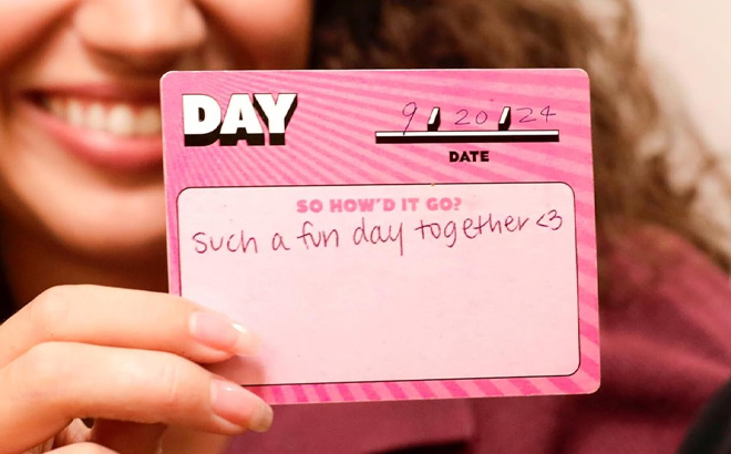 A Person Holding Date Night Scratch Off Card