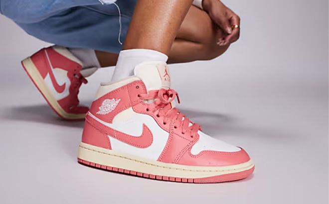 A Person Wearing the Nike Air Force 1 Womens Shoes in Pink