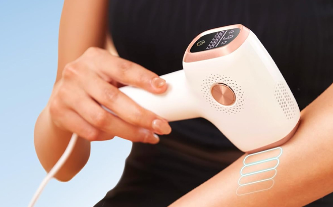 A Woman Using the INNZA IPL Hair Removal Device