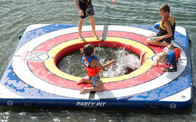 People playing on an HO Sports Inflatable Water Mat Party Pad People playing on an HO Sports Inflatable Water Mat Party Pad