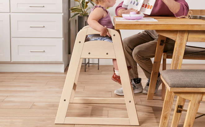 Toddler Sitting on a High Chair