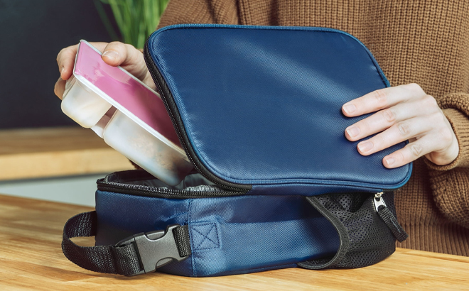 Your Zone Insulated Polyester Reusable Lunch Bag in Navy Blue Color on a Table