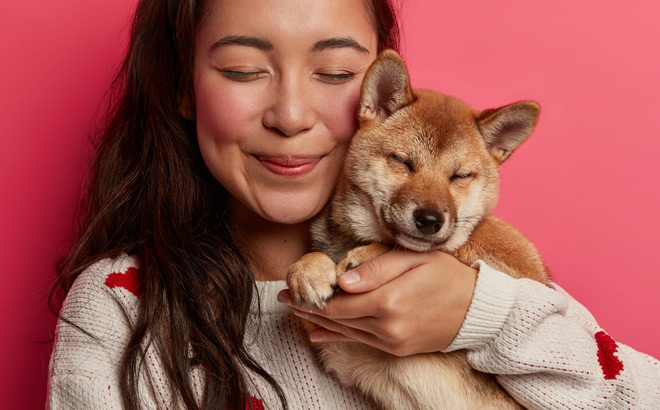 A Happy Woman Holding Her Dog