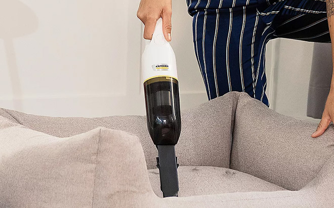 A Person Holding Karcher CVH 2 Cordless Handheld Vacuum Cleaner A Person Holding Karcher CVH 2 Cordless Handheld Vacuum Cleaner