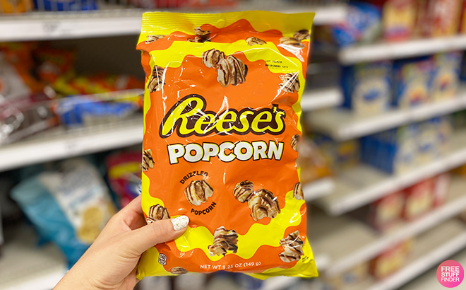 A Person Holding Reeses Popcorn Bag A Person Holding Reeses Popcorn Bag