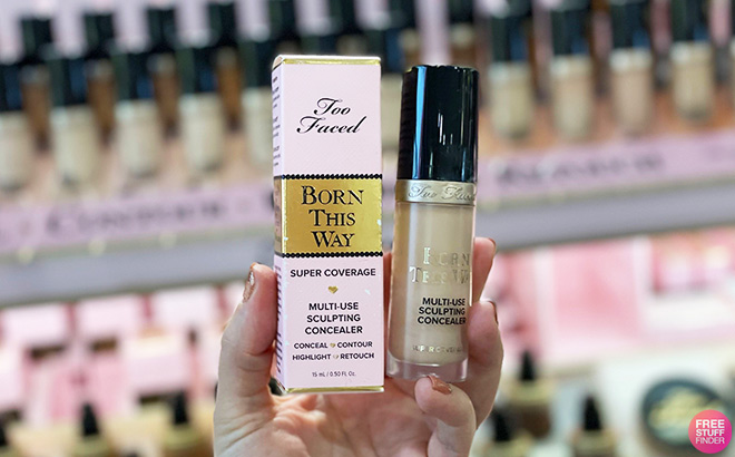 A Person Holding Too Faced Born This Way Super Coverage Multi Use Concealer