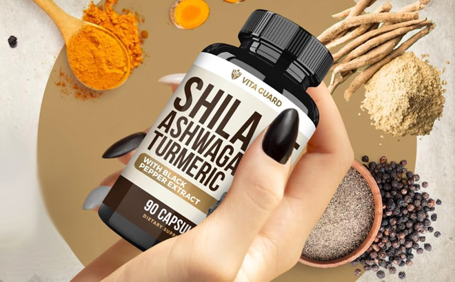 A Person Holding Vita Guard Himalayan Shilajit Ashwagandha Turmeric Capsules A Person Holding Vita Guard Himalayan Shilajit Ashwagandha Turmeric Capsules