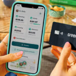 A Person Holding a Greenlight Debit Card