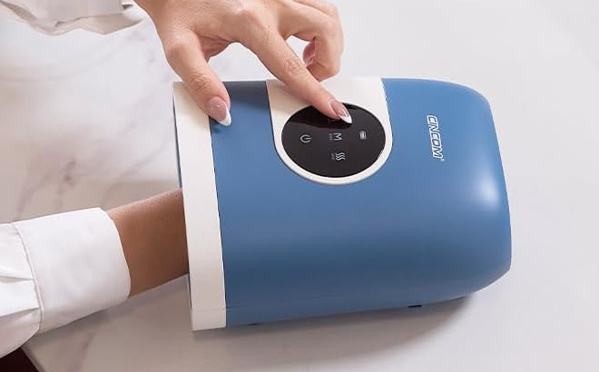 A Person Using Hand Massager