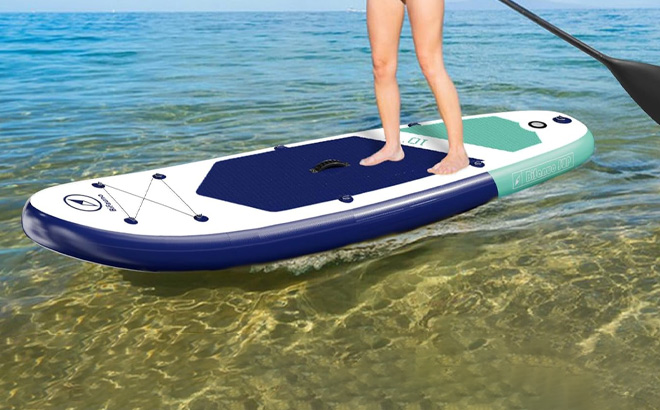 A Person Using Inflatable Stand Up Paddle Board