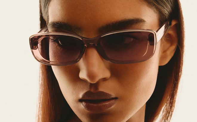 A Person Wearing Quay Australia Vibe Check Sunglasses A Person Wearing Quay Australia Vibe Check Sunglasses