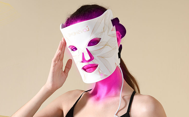 A Woman Using the Lovsheme Red Light Therapy Mask for Face