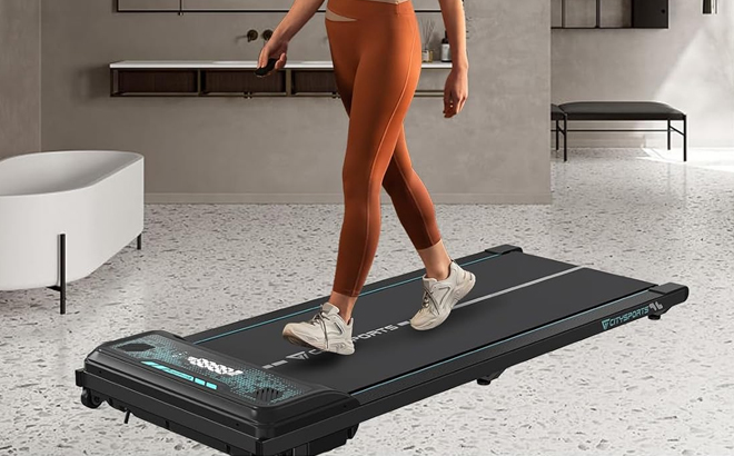 A Woman Walking on the CITYSPORTS Under Desk Treadmill A Woman Walking on the CITYSPORTS Under Desk Treadmill