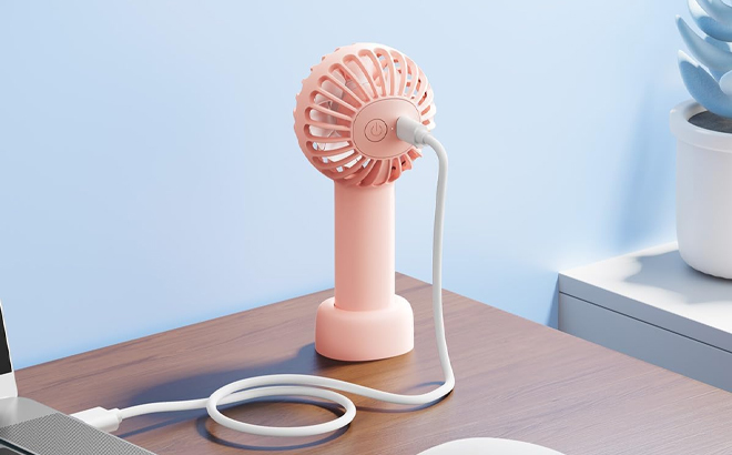 Rechargeable Handheld Fan on a Table