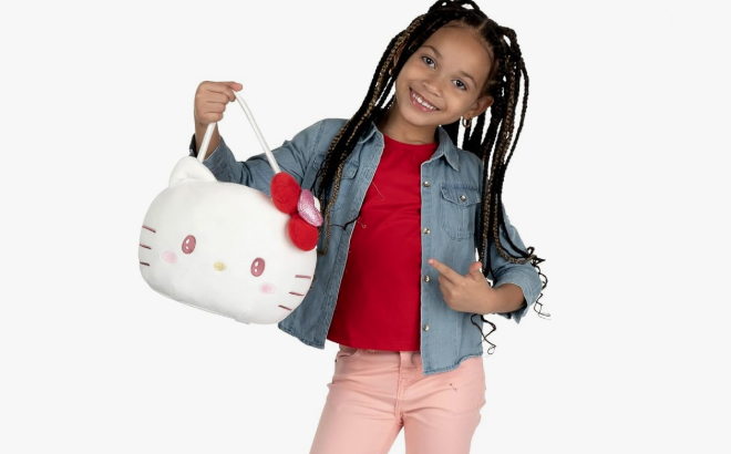 A Girl Holding Hello Kitty and Friends Official Plush Pail