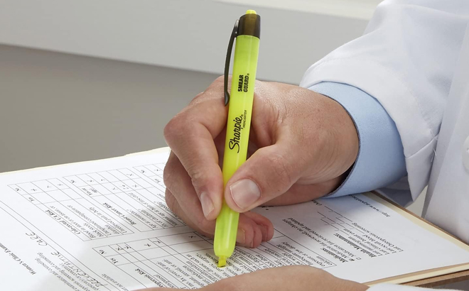 A Man Using a Sharpie Retractable Highlighter