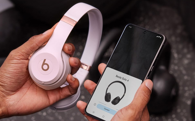 A Person Holding Beats Solo 4 Wireless Bluetooth On Ear Headphones A Person Holding Beats Solo 4 Wireless Bluetooth On Ear Headphones