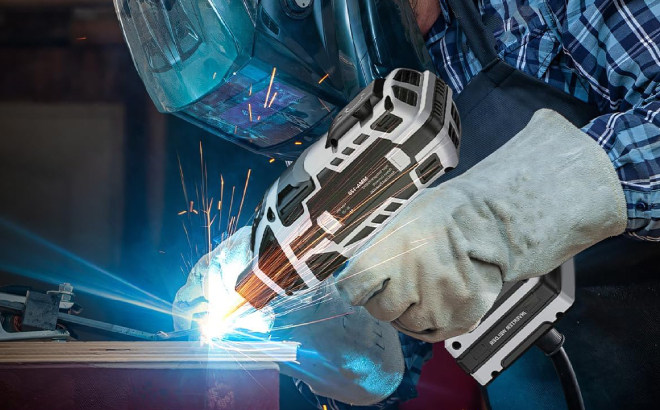 A Person Using a Saker Portable Electric Welding Machine