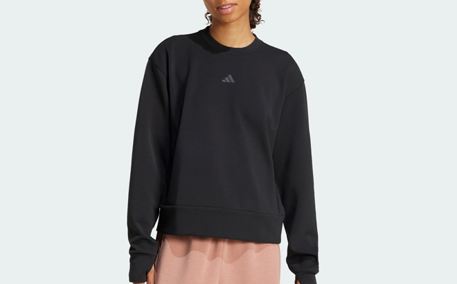 A Woman Wearing Adidas Warm Up Crewneck Sweatshirt A Woman Wearing Adidas Warm Up Crewneck Sweatshirt