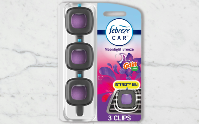 Febreze Car Air Freshener 3 Count Pack on a Table Febreze Car Air Freshener 3 Count Pack on a Table