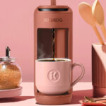 Keurig K Mini Mate Single Serve K Cup Pod Coffee Maker in Red Color on the Table