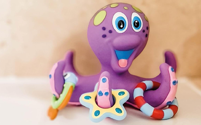 Nuby Floating Octopus Bath Toy with 3 Hoopla Rings Nuby Floating Octopus Bath Toy with 3 Hoopla Rings