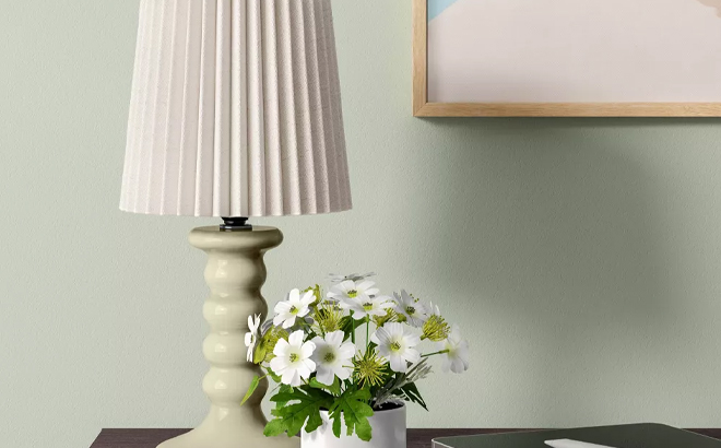 Room Essentials Mini Stick Table Lamp with Pleated Shade Green on a Table