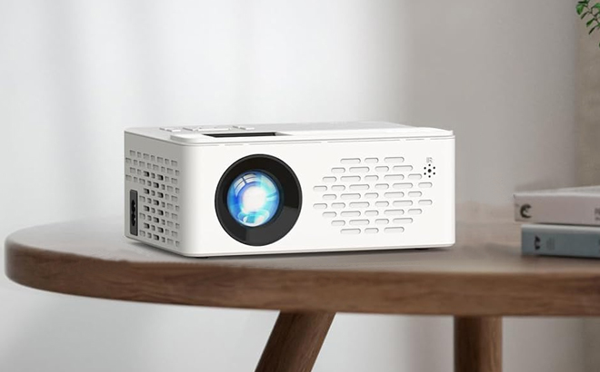 TMY Mini Bluetooth Projector on a Table