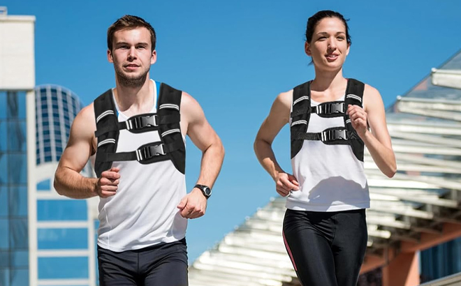 Two People Wearing Weighted Vests While Running Two People Wearing Weighted Vests While Running