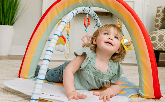A Baby Playing in a Hopscotch Baby Activity Gym