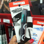 A Hand holding Rimmel London Scandaleyes Retro Glam Mascara