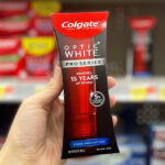 A Person Holding Colgate Optic White Pro Series Stain Prevention Hydrogen Peroxide Whitening Toothpaste