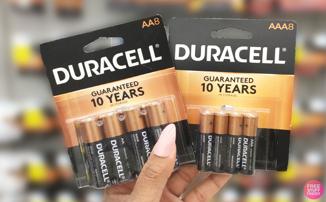 A Person Holding Duracell 8 Count Batteries