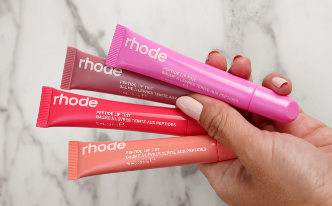 A Person Holding Four Lip Tints