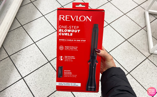 A Person Holding REVLON One Step Blowout Styler
