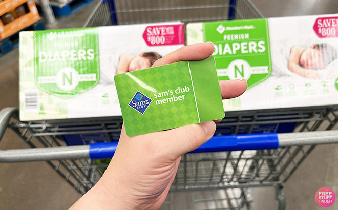 A Person Holding Sams Club Card inside a Store A Person Holding Sams Club Card inside a Store