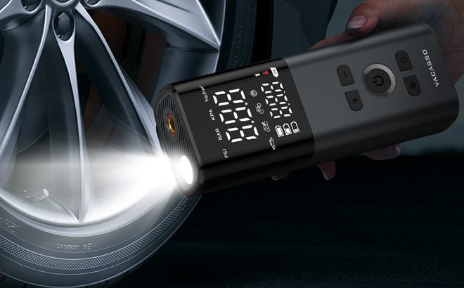 A Person Holding Tire Inflator A Person Holding Tire Inflator