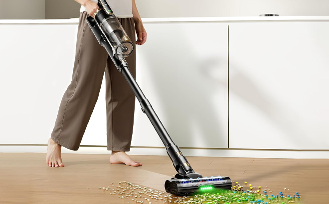 A Person Using Cordless Vacuum Cleaner