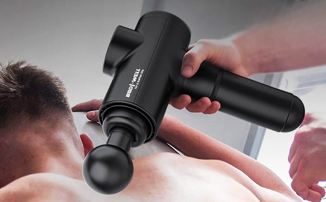 A Person Using a Deep Tissue Massage Gun