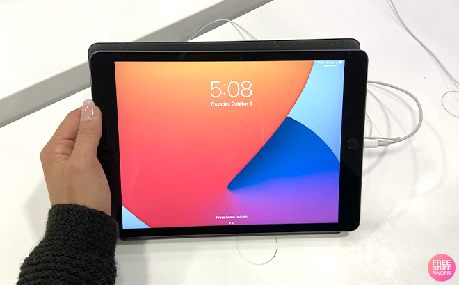 A Woman Holding an Apple iPad